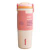 An Owala 30 oz travel tumbler with a pink and cream design, featuring a built-in straw lid and carrying handles, shown on a plain white background.
